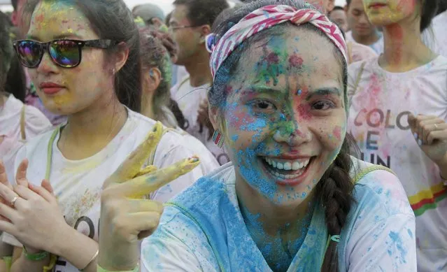 Participants are covered in colored powder as they prepare to compete in The Color Run, a five-kilometre untimed race, in Hanoi, Vietnam September 26, 2015. (Photo by Reuters/Kham)