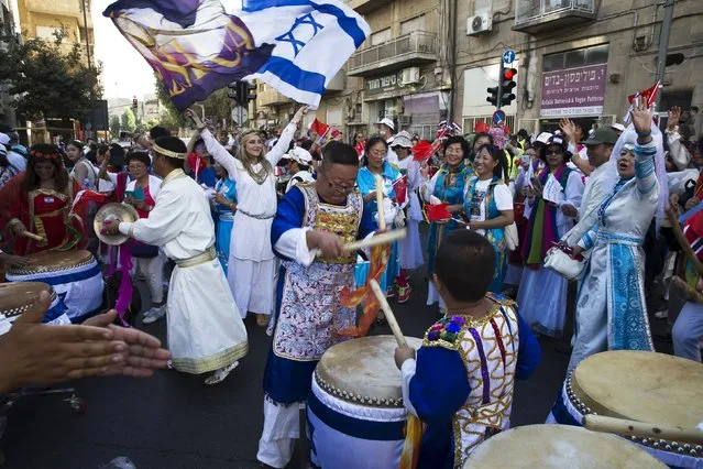 Participants celebrate during an annual parade on the Jewish holiday of Sukkot in Jerusalem October 1, 2015. (Photo by Ronen Zvulun/Reuters)