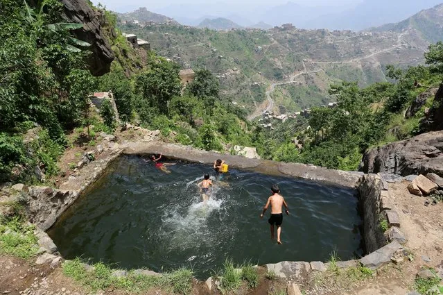 Boys swim in a pond in the mountains, in the Jafariya district of the western province of Raymah, Yemen June 2, 2016. (Photo by Abduljabbar Zeyad/Reuters)