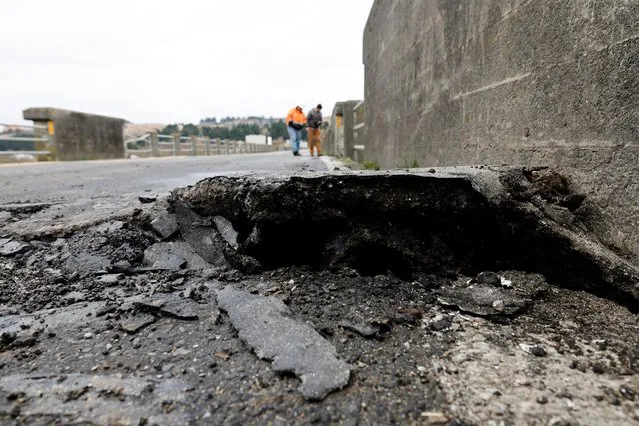 Large crack in bridge surface is seen after a strong 6.4-magnitude earthquake struck off the coast of northern California, in Rio Dell, California, U.S. December 20, 2022. (Photo by Fred Greaves/Reuters)