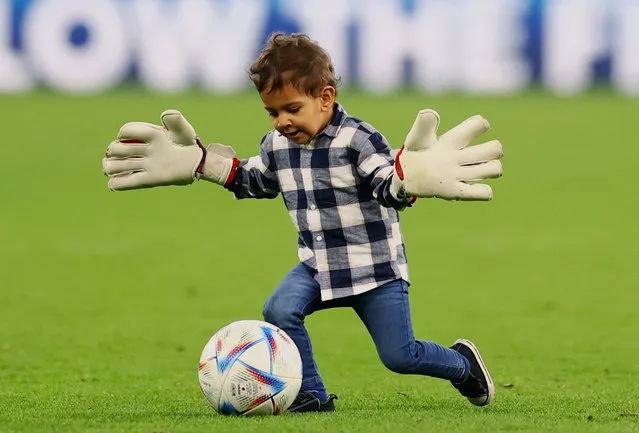 Morocco player Yassine Bounou's son, Isaac, plays on the pitch after the country's World Cup win against Portugal at Al Thumama Stadium in Doha, Qatar on December 10, 2022. (Photo by Carl Recine/Reuters)