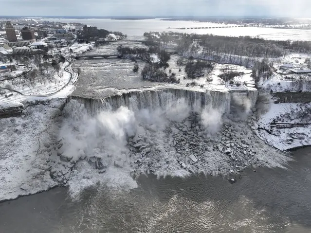 An aerial view of the partially frozen Niagara Falls, which is on the border with Canada, on December 27, 2022 in Niagara Falls, New York. A massive winter storm hit much of the United States in recent days. (Photo by Lokman Vural Elibol/Anadolu Agency via Getty Images)