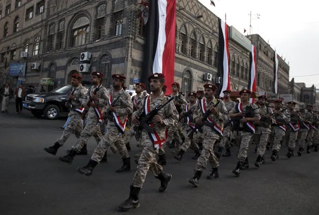 Houthi militants march during a rally commemorating the 52nd anniversary of the start of South Yemen's uprising against British rule, in Sanaa October 14, 2015. (Photo by Khaled Abdullah/Reuters)