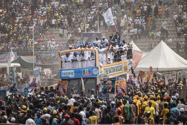 The bus of Presidential candidate, Bola Tinubu of the All Progressives Congress (APC) arrives at the Teslim Balogun Stadium during their final campaign rally in Lagos on February 21, 2023, ahead of the Nigerian presidential election scheduled for February 25, 2023. (Photo by John Wessels/AFP Photo)
