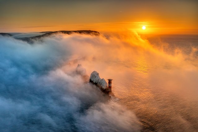 A landscape photographer has captured a stunning picture of the Isle of Wight's iconic Needles emerging from the sea mist early February 2023. Jamie Russell captured this moment on the most western part of the island. (Photo by Jamie Russell/IslandVisionss/Bournemouth News)