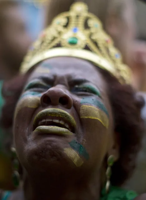 In this July 8, 2014 file photo, a Brazil soccer fan weeps as she watches Germany score repeatedly against Brazil at a World Cup semifinal match on a live telecast inside the FIFA Fan Fest area in Sao Paulo, Brazil. (Photo by Dario Lopez-Mills/AP Photo)