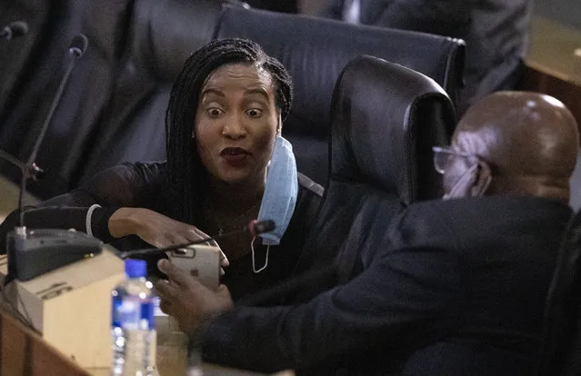 Former South African President Jacob Zuma, right, sits with his daughter Duduzile Zuma, as he waits for the state capture hearings to get underway in Johannesburg, South Africa, Thursday, November 19, 2020. Former President Jacob Zuma is appearing before a state commission investigating serious allegations of corruption during his tenure as head of state between 2009 and 2018. (Photo by Themba Hadebe/AP Photo)