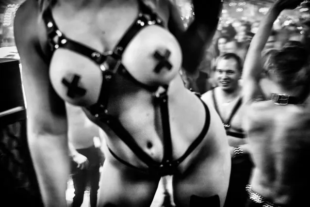 The underbelly of fetish parties has been exposed in photographs captured by Belgian photographer MagLau. The photographer dedicated three years to capturing the obsession with leather and chains, visiting fetish parties through Europe and Japan. The photographer told: “I just took pictures, always finding some beauty in the dark side”. He said that most people were happy to be photographed for the project, with the images included in a new book Fetish Ballad. Aiming to capture the candid moments, he said he never judged but instead wanted to simply observe and understand. Here: Picture from Fetish Ballad book. (Photo by MagLau/Laurent Muschel)
