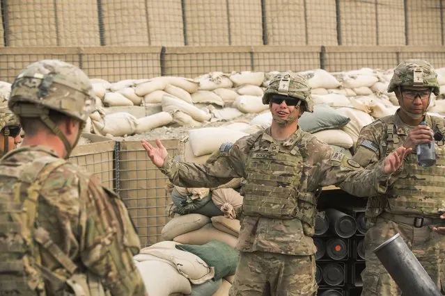 U.S. soldiers from the 3rd Cavalry Regiment joke around with each other during an exercise on forward operating base Gamberi in the Laghman province of Afghanistan December 24, 2014. (Photo by Lucas Jackson/Reuters)