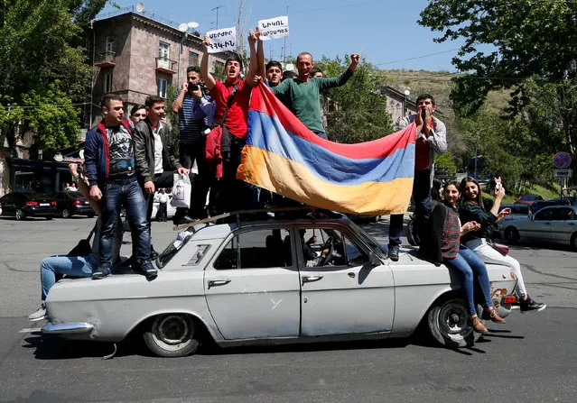 Supporters of Armenian opposition leader Nikol Pashinyan drive a car during a rally in Yerevan, Armenia April 25, 2018. (Photo by Gleb Garanich/Reuters)