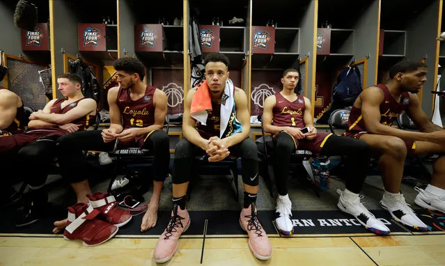 Loyola-Chicago's Marques Townes (5) and the rest of the team react in the locker room after the semifinal game against Michigan in the Final Four NCAA college basketball tournament, Saturday, March 31, 2018, in San Antonio. Michigan won 69-57. (Photo by Eric Gay/AP Photo)