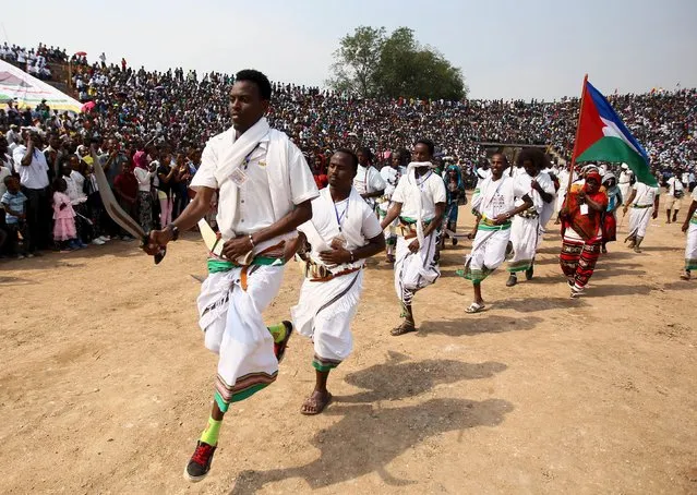 Cultural dancers from Afar region performs at Gambela stadium during Ethiopia's Nations and Nationalities Festival in Gambela town, in Ethiopia, December 9, 2015. (Photo by Tiksa Negeri/Reuters)