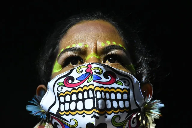 An actor characterized as prehispanic performs la llorona show as part of Day of the Dead celebrations in Mexico City, Mexico on October 7, 2020. The llorona is a Mexican legend who describe the soul of a woman who drowned her children, she appears in rivers and cities, scaring people with her weeping, the legend of the llorona has been known since the decade of 1521, before the conquest of the Spanish. (Photo by Carlos Tischler/Rex Features/Shutterstock)