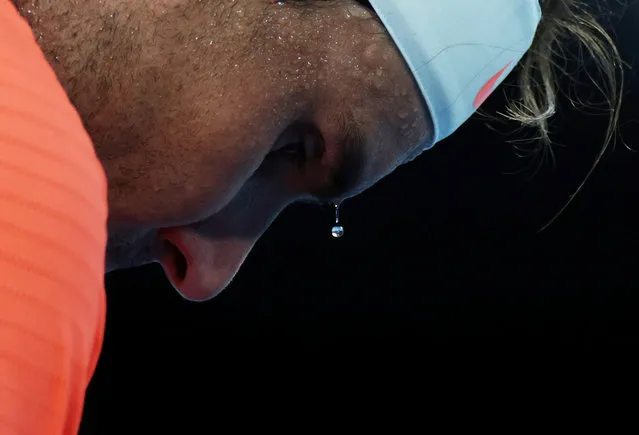 A bead of sweat drips from Spain's Rafael Nadal during his second round match against Michael Mmoh of the U.S. at the Australian Open tennis championship in Melbourne, Australia on February 11, 2021. (Photo by Loren Elliott/Reuters)