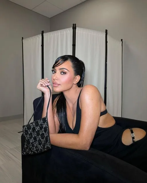 American media personality Kim Kardashian and her slicked-down side bangs in the last decade of May 2023 encourage followers to “manifest“ their “dreams”. (Photo by kim kardashian/Instagram)