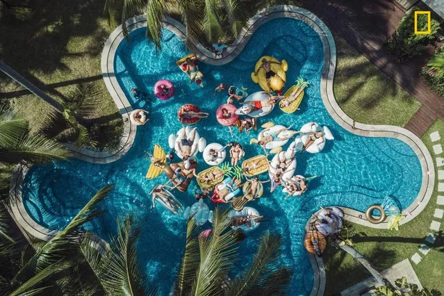 The Ultimate Pool Party. Raja Iliya captures the idyllic scene of a summer pool party in Koh Samui, Thailand. (Photo by Raja Iliya/National Geographic Travel Photographer of the Year Contest)