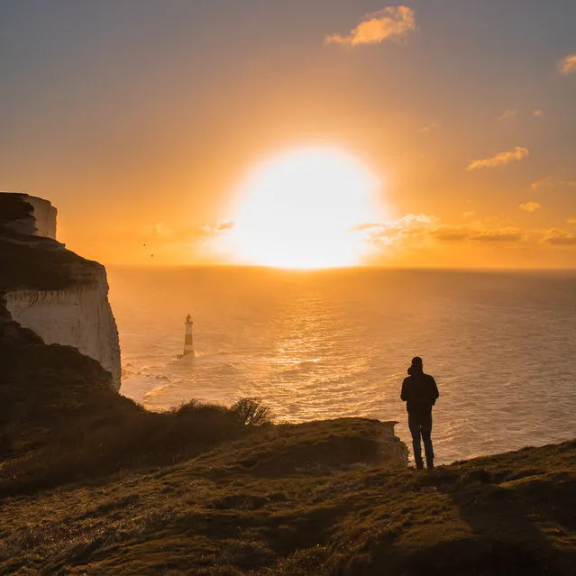“Beachy Head, Eastbourne. Packing up at the end of a sunrise shoot, I decided to keep my camera in hand for the walk back. I’m glad I did: I saw my friend looking out to sea, deep in contemplation”. (Photo by Lewis Hanson/The Guardian)