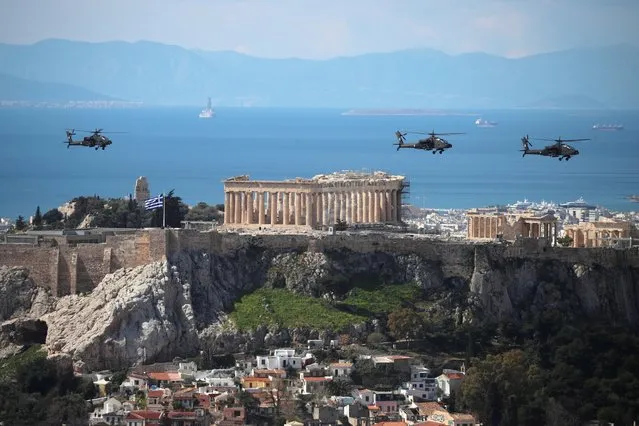 Military helicopters fly over the Parthenon during celebrations for the 200th anniversary of the Greek War of Independence in Athens, Greece on March 25, 2021. (Photo by Costas Baltas/Reuters)