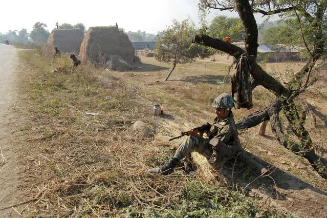Indian army soldiers take position outside the Pathankot air force base in Pathankot, India, Sunday, January 3, 2016. (Photo by Channi Anand/AP Photo)