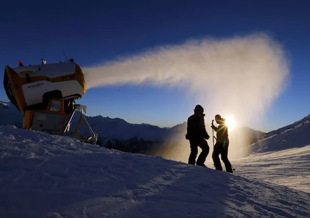 Snowmakers of the Verbier ski resort check the artificial snow making machine in Verbier, Switzerland, November 28, 2016. (Photo by Denis Balibouse/Reuters)