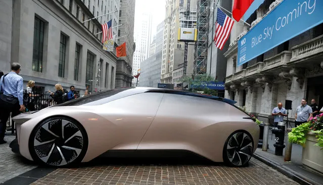 Chinese electric vehicle start-up NIO Inc. vehicle is parked in front of the New York Stock Exchange (NYSE) to celebrate the company's initial public offering (IPO) in New York, U.S., September 12, 2018. (Photo by Brendan McDermid/Reuters)