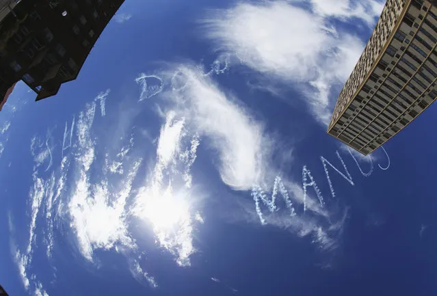 “Shut Down Manus” is written in the sky, funded by asylum seeker activists over Sydney Harbour on February 17, 2015 in Sydney, Australia. The sky message was commissioned by activists on the one year anniversary of the death of Iranian asylum seeker, Reza Berati during a riot at the Manus Island Regional Processing Centre. (Photo by Ryan Pierse/Getty Images)