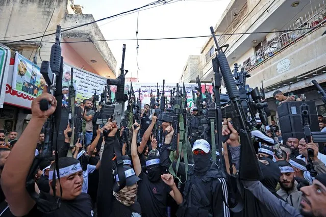 Palestinian militants from the Balata Brigade gather during a memorial rally in the refugee camp of Balata near the West Bank city of Nablus on September 29, 2023 marking the death anniversary of Mohammed Abu Asab, who was killed by Israeli security forces. (Photo by Zain Jaafar/AFP Photo)