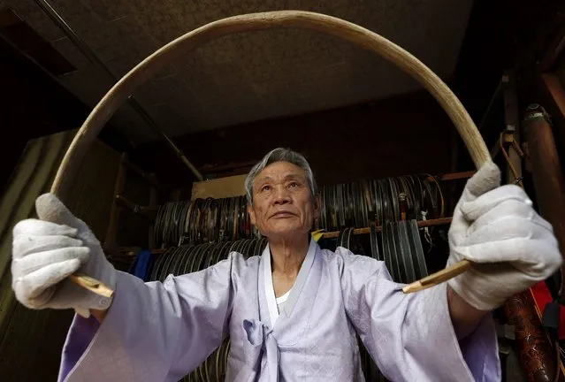 South Korean traditional bow artisan Kwon Yeong-Hak works on a bow in his workshop in Yecheon-gun, Gyeongsangbuk-do, South Korea, 26 February 2015. (Photo by Jeon Heon-Kyun/EPA)