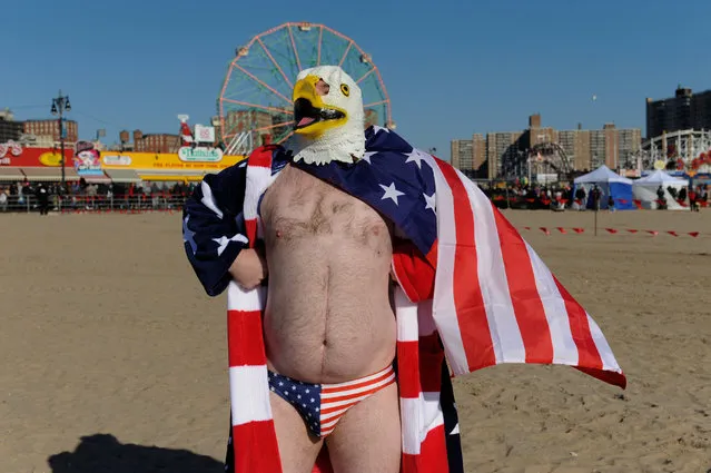A man wearing an United States flag themed outfit prepares to participate in the annual Polar Bear Plunge in Coney Island in the Brooklyn Borough of New York City, U.S. January 1, 2017. (Photo by Stephanie Keith/Reuters)