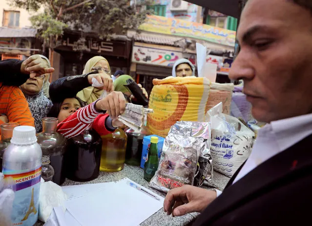 Customers buy natural herbal drugs and consumer goods at a herbal store, in Cairo, Egypt January 10, 2017. (Photo by Mohamed Abd El Ghany/Reuters)