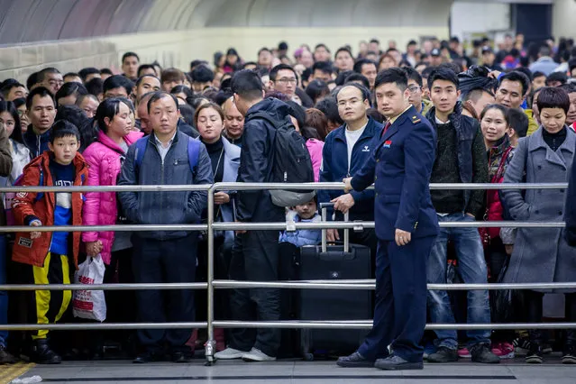 Passengers wait to enter a railway station during the annual Spring Festival travel rush ahead of the Chinese Lunar New Year in Guangzhou, Guangdong province, China January 14, 2017. (Photo by Reuters/Stringer)