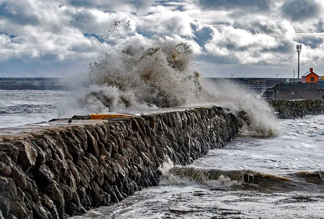 Waves crash against the harbour wall during Storm Ciaran in Folkestone, Kent, Britain, 02 November 2023. The storm is causing severe disruption in the south of England with strong winds and rain. Flooding is expected in 54 areas, according to the Environment Agency, most of which are on the south coast of England. (Photo by Stuart Brock/EPA)