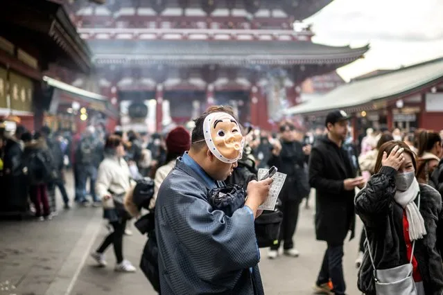 People visit Sensoji Temple, a popular tourist location, in Tokyo on January 18, 2024. (Photo by Philip Fong/AFP Photo)