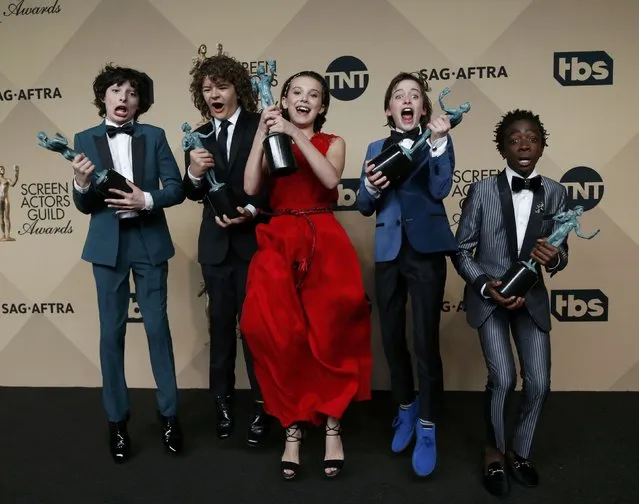 The cast of “Stranger Things” poses with the awards they won for Outstanding Performance by an Ensemble in a Drama Series backstage at the 23rd Screen Actors Guild Awards in Los Angeles, California, U.S., January 29, 2017. (Photo by Mario Anzuoni/Reuters)