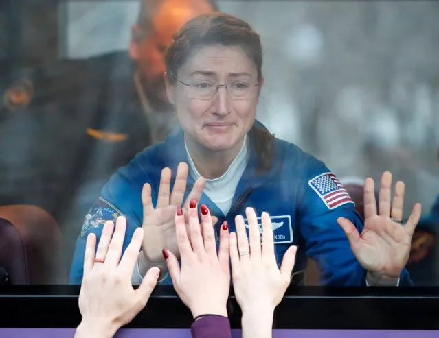 The International Space Station (ISS) crew member Christina Koch of the U.S. reacts in a bus before leaving for pre-flight preparation at the Baikonur Cosmodrome, Kazakhstan March 14, 2019. (Photo by Shamil Zhumatov/Reuters)