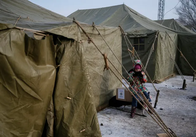 A local resident has a meal at an emergency center after shelling hit supply infrastructure in the government-held industrial town of Avdiyivka, Ukraine, February 3, 2017. (Photo by Gleb Garanich/Reuters)