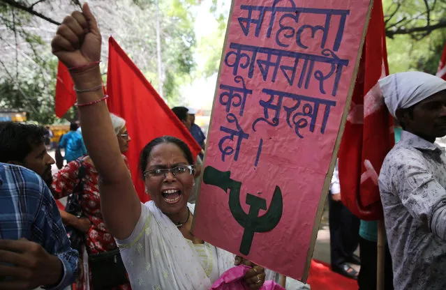Indian members of the federation of the trade Unions Delhi committee shout slogans and attend a rally to mark the International Labor Day in New Delhi, India, 01 May 2019. Labor Day or May Day is observed all over the world on the first day of the month of May to celebrate the economic and social achievements of workers and fight for laborers rights. (Photo by Rajat Gupta/EPA/EFE)