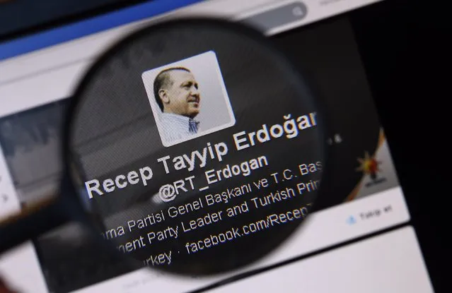 An image of Turkish Prime Minister Tayyip Erdogan on a twitter account is pictured through a magnifying glass in this illustration picture taken in Istanbul March 21, 2014. Turkey's courts have blocked access to Twitter days before elections as Prime Minister Tayyip Erdogan battles a corruption scandal that has seen social media platforms awash with alleged evidence of government wrongdoing. (Photo by Murad Sezer/Reuters)