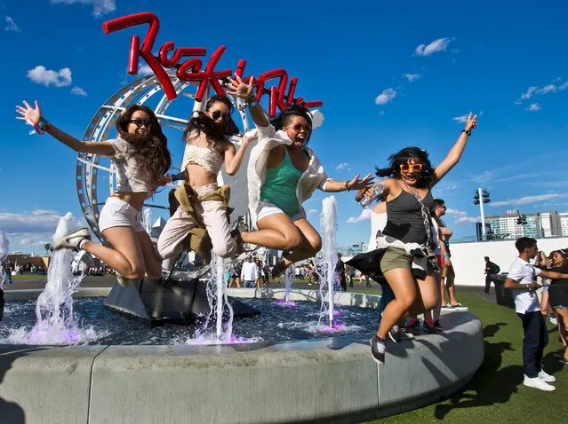 Fans jump together from the fountain during the final day of the Rock in Rio USA concert in Las Vegas, Nevada May 16, 2015. (Photo by L. E. Baskow/Reuters)