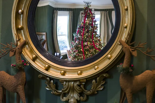 Holiday decorations are seen reflected in a mirror at the Vice President's residence, Thursday, December 6, 2018, in Washington. (Photo by Alex Brandon/AP Photo)