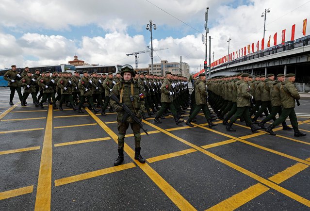 Russian service members march in columns before a military parade on Victory Day, which marks the 79th anniversary of the victory over Nazi Germany in World War Two, in central Moscow, Russia, on May 9, 2024. (Photo by Shamil Zhumatov/Reuters)