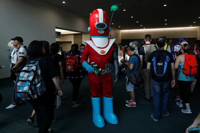 An attendee poses for a picture as they arrive in costume to enjoy Comic Con International in San Diego, California, U.S., July 19, 2019. (Photo by Mike Blake/Reuters)
