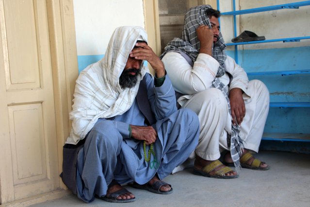 Relatives attend the funeral of an Afghan man who was killed in a suicide attack at Kabul bank, in Kandahar, Afghanistan, 21 March 2024. A suicide attack at a bank in Kandahar on 21 March killed three people and injured 12 others, hospital staff said. The incident took place during salary distribution at Kabul Bank, a common target for insurgent attacks. Security forces are investigating the attack, which occurred during the Islamic holy month of Ramadan. The Islamic State branch in Afghanistan is considered a significant security threat, although no group has claimed responsibility for this particular attack. (Photo by Qudratullah Razwan/EPA/EFE)