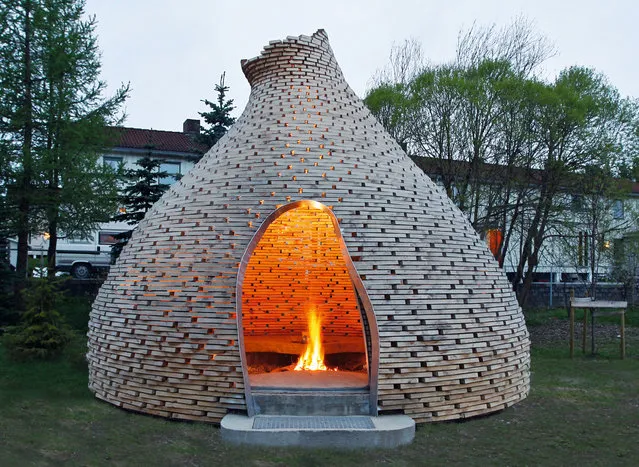 Fireplace for children, Trondheim, Norway, by Haugen/Zohar. The children of Trondheim come to sit around the fire and tell stories in this whimsical cone hut, made with materials recycled from a construction site. (Photo by Jason Havneraas/The Guardian)