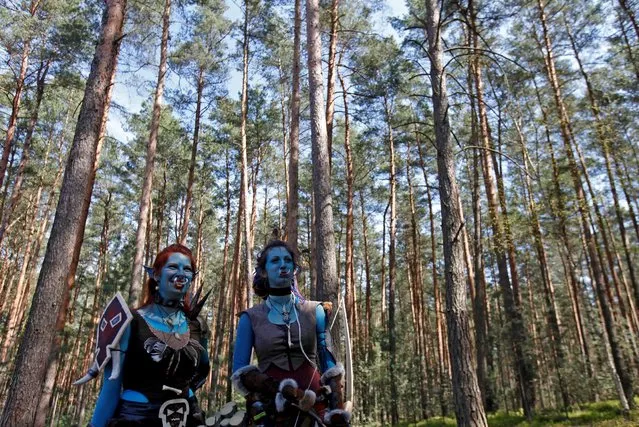 Women dressed as characters from the computer game “World of Warcraft” stand in a forest near the village of Sosnova, Czech Republic, April 30, 2016. (Photo by David W. Cerny/Reuters)