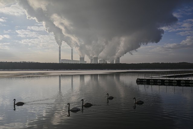 A view of lignite coal-powered Belchatow Power station as smoke and steam rises from the cooling towers in Rogowiec, Poland on November 30, 2023. The 5,298MW Belchatow power plant is the biggest coal-fired power plant in Europe. (Photo by Omar Marques/Anadolu via Getty Images)
