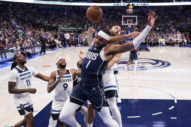 Dallas Mavericks guard Jaden Hardy (1) scores past Minnesota Timberwolves forward Kyle Anderson, right, during the second half in Game 4 of the NBA basketball Western Conference finals, Tuesday, May 28, 2024, in Dallas. (Photo by Julio Cortez/AP Photo)