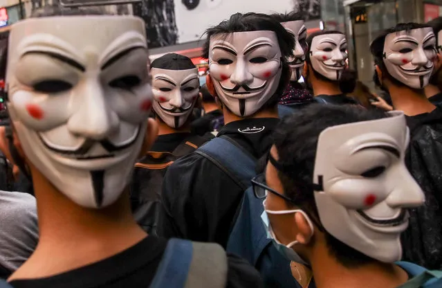 Protesters wearing Guy Fawkes masks take part in an Anti-ERO (Emergency Regulations Ordinance) demonstration against a newly imposed law banning face masks in public in Hong Kong, China, 06 October 2019. Anti-government protesters took to the streets against the government's use of emergency powers to ban face masks in public in a bid to end the city's protests. Hong Kong has been gripped by mass demonstrations since June over a now-withdrawn extradition bill, which have since morphed into a wider anti-government movement. (Photo by Fazry Ismail/EPA/EFE)