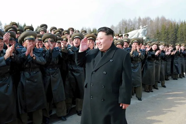 North Korean leader Kim Jong Un visits Korean People's Army pilots who have completed a tour of battle sites in the area of Mt Paektu, in this undated photo released by North Korea's Korean Central News Agency (KCNA) on April 19, 2015. (Photo by Reuters/KCNA)
