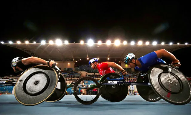 China’s Yunqiang Dai and Thailand’s Putharet Khongrak in action during the Men’s 5000m T54 Final at the 2019 World Para Athletics ChampionshipsAthletics in Dubai, United Arab Emirates on November 13, 2019. (Photo by Christopher Pike/Reuters)